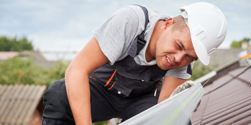 Roof technician working carefully